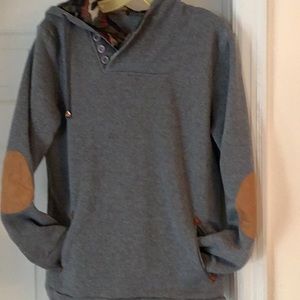 Gray and camouflage hoodie sweatshirt.